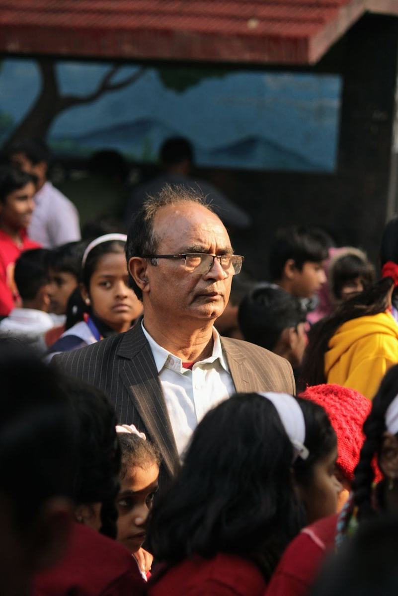 The director with students at an event